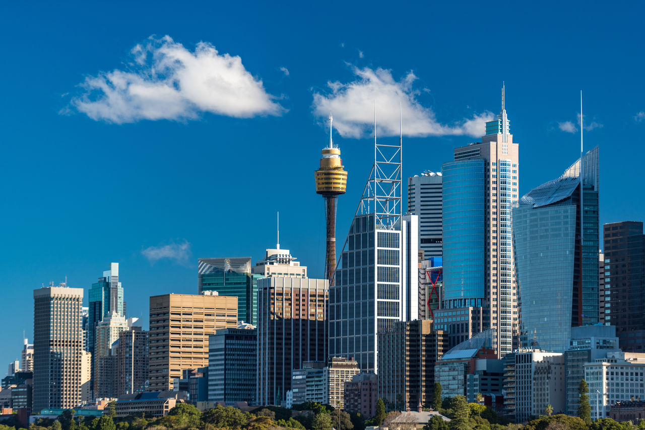 Sydney skyline with Sydney Tower and Sydney Business District skyscrapers on sunny day. Modern cityscape